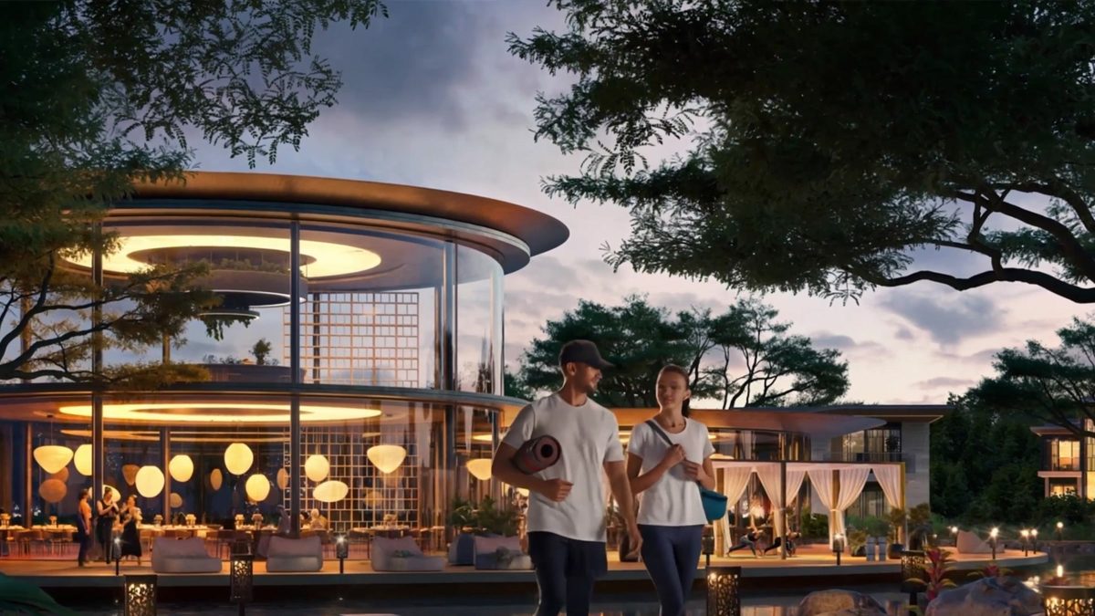 A glass club pavilion among trees at dusk, lanterns lighting the path to it