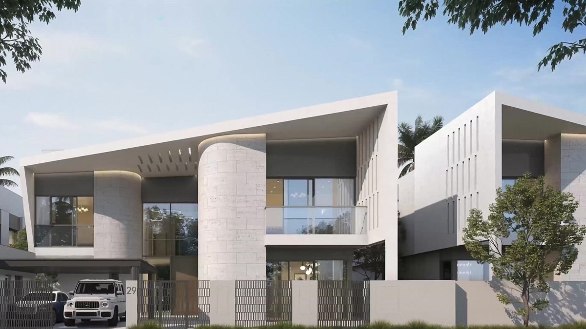 A mansion of pale stone with deep cantilevered roofs behind a gated forecourt