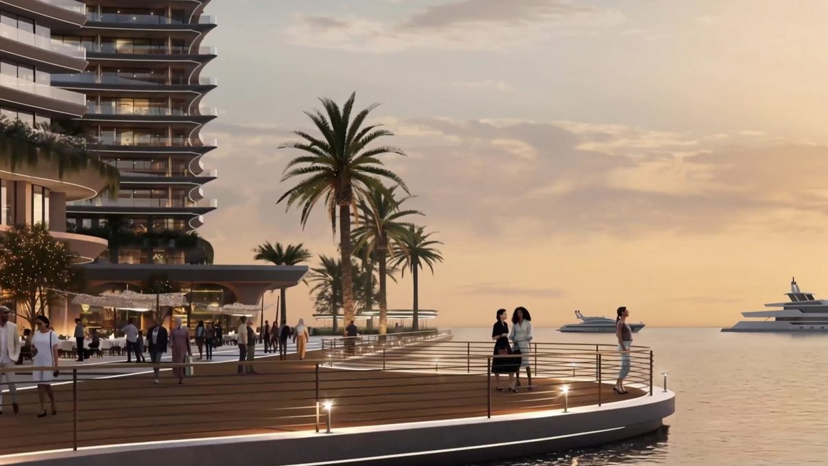 The marina promenade at sunset: a curved timber deck, palms, and yachts offshore